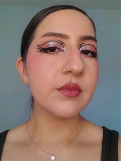 Fullglamdaydream on Instagram: "Soft glam with a twist 🖤. I recreated this old look from @fairy.freak that I had saved. I tend to stick to the same graphic liner shapes but this one challenged me 😅. It was a trust the process look. If you think my eyeliner skills are good, her's are insane! Really like how it came out. Picked up a new tower 28 blush! Tbh the color is kinda boring compared to my fuschia pink from them but I needed a basic blush color. So it's perfect for that. Hope you have a g