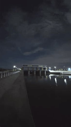 clip-4005626925-dam-structure-night-over-water