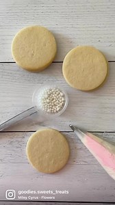 38K views · 38 reactions | Oh, the magic of tip 104!  Buttercream flower tinted with light pink accented with edible pearls. | Goodies - Sweets & Treats | Facebook