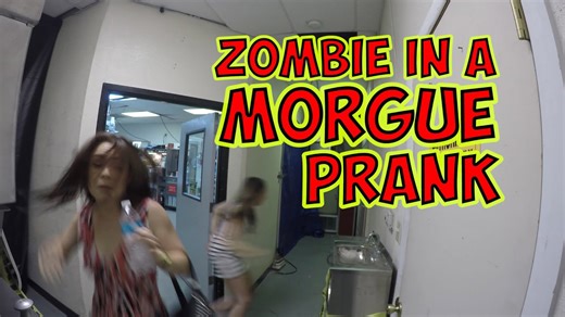 Crowd jumps as a zombie appears in a morgue setting