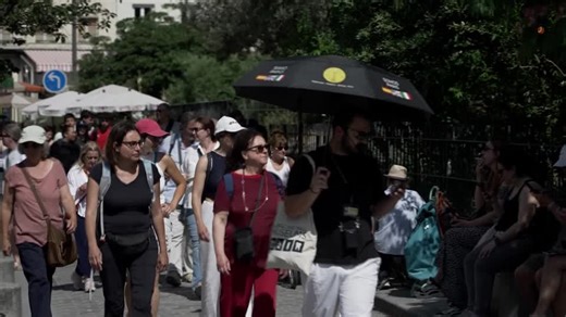 A heatwave sweeping across France pushed temperatures in Paris to 87.8 degrees Fahrenheit, prompting tourists to seek relief in the city’s fountains and shade. | Reuters