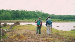 Two young Asian female hikers enjoying an outdoor adventure in nature. Exploring scenic trails, embracing freedom and fresh air during their trekking journey