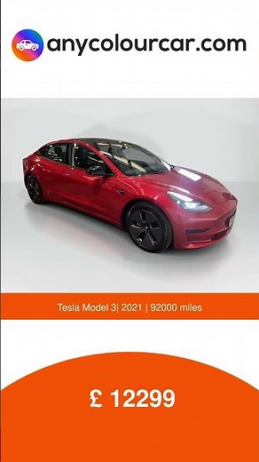A vibrant 2021 Tesla Model 3 in red. Fully electric and ready for its