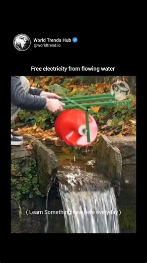 Teach You Everything on Instagram: "The post features a 22-second video of a DIY micro-hydroelectric setup, where a halved plastic drum serves as a water wheel in a stream, driving a generator via chain to illuminate an LED bulb, emphasizing low-cost renewable energy for off-grid use. This demonstrates fundamental hydroelectric principles, akin to the 1880s Pelton wheel turbine, but scaled down for personal applications; replies highlight its familiarity, with sarcasm noting it's rediscovered ba