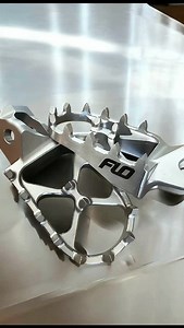 Got Grip? - STAINLESS STEEL FOOT PEGS Constructed from cast, heat treated and hardened stainless steel Designed for Comfort and Durability in the harshest conditions Wide platform of 60 Wide x 95mm Long #FloMotorsports #FootPegs ☝️ | FLO Motorsports