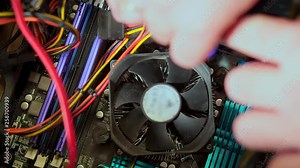 Close-up, the service man unscrews the CPU fan. Personal computer repair Stock Video