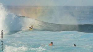 a body board rider gets a tube ride at pipeline on the north shore of oahu, hawaii