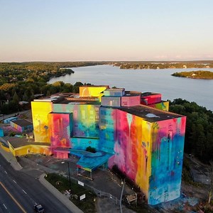 As part of the Up Here festival, 2019 Los Angeles-based urban artist Kelly Gravel aka RISK created a large-scale mural on the abandoned St Joseph's Hospital in Sudbury. By pursuing total coverage of buildings, RISK creates hyper-objects that affect people and evoke emotion through his use of vibrant colour. For this particular project RISK, added delicate butterflies to the old vandalised building, transforming it into something beautiful. #art #artist #artwork #urbanart #urbanartist #streetart 