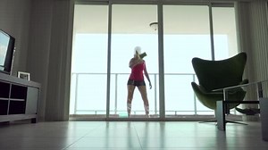 Woman cleaning window with a sponge