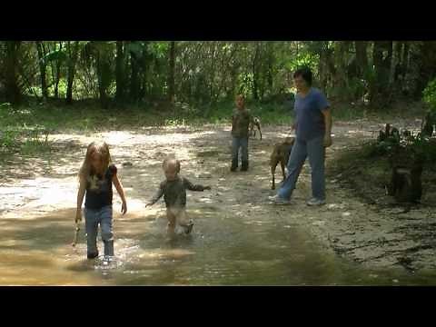 kids playing in creek