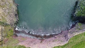 aerial looking directly down on a hidden cove on The Copper Coast Waterford on a calm winter morning