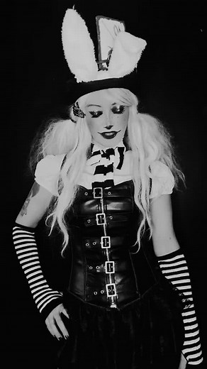 Fantasy Costume Performance with Striped Accents