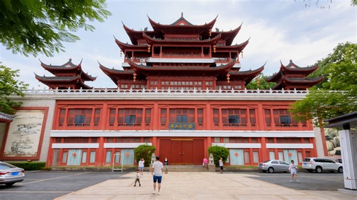 A large palace style building in China stands out with its layered roof design