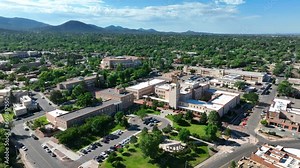 Government buildings in downtown Santa Fe, New Mexico. State Capitol grounds. Aerial establishing shot on summer day.