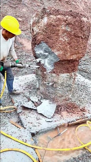 Using a Jackhammer to Break Up a Large Concrete or Rock Foundation