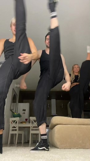 Synchronized Dance Routine in a Stylish Living Room