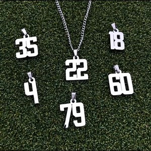 7K reactions · 1.4K shares | The perfect necklace for athletes!  Rep your uniform number on & off the field. SAVE 15% today with code: NC15 | Elite Athletic Gear | Facebook