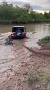 Giant Crocodile Attacks SUV in River Crossing Darwin, Australia — September 2, 2024 A terrifying encounter between a massive saltwater crocodile and a group of off-roaders was captured on film this weekend near a remote river crossing. What began as a standard river crossing for a late-model Jeep turned into a life-or-death struggle as a prehistoric predator lunged from the murky waters to defend its territory. The dramatic footage shows the dark green Jeep Wrangler wading through the brown, sil