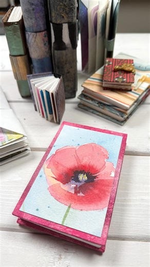 I still love folding books inspired by Hedi Kyle. I've made variations of her Blizzard book for nearly thirty years, and I never tire of making them. 🩷 I made a new variation this weekend and filled the pockets with watercolor florals. 🌷 #creativelifehappylife #watercolorflorals #bookart #foldedbooks | Karen Elaine