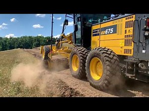Topcon 3D MC2, installed on a Komatsu grader and a dozer .
