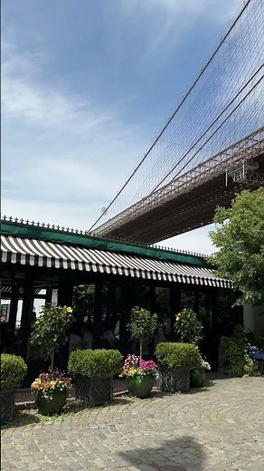 The River Cafe restaurant and Brooklyn Bridge on 19th May 2023