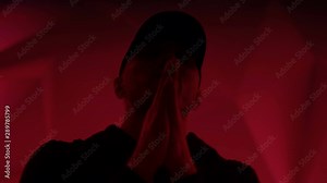 Rapper guy rap in front of the camera on a colorful background