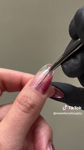 How to: Deep pink cateye swirl tutorial 🌀💗 Video by: @gelsbydiana Recreate using: From the Nail - Rosecore Collection Available at www.sweetienailsupply.com #gelnails #koreannails #naildesign #pinkcateye #cateyenailtutorial