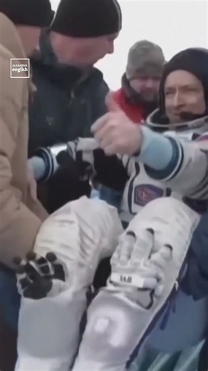 Spacecraft Brings Russians, American Back to Earth