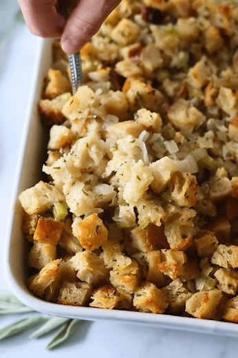 If you’ve never made stuffing with sourdough bread - it’s a game changer!! Game changer! Crispy edges and never soggy - just perfectly delicious. This Sourdough Stuffing recipe uses homemade sourdough bread, fresh herbs, and bone broth for the most flavorful, crispy side dish perfect for Thanksgiving or any Sundar evening feast. Save yourself time and bake a loaf now, cut it into cubes and freeze it until the night before! Let the bread thaw overnight and make the stuffing as normal the day of. 