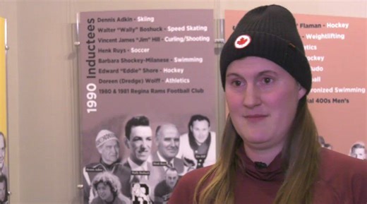 Olympic champion reads to students