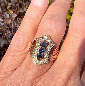 No sparkle filter needed for this gorgeous diamond sapphire shield style ring in 14k gold. The curved split shoulders wrap effortlessly around the finger for an extremely comfortable fit. This ultra sparkler just listed on our site and she’s ever so glam! 💙 #sapphirering #sapphirejewelry #bluemood #bluegemstone #diamondsapphirering #shieldring #statementjewelry #statementring #bluesapphire #sapphirelove #vintagesapphirering #intensesparkle #sayitwithdiamonds #impressive | Boylerpf Antique Vinta