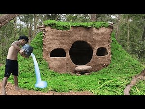 Building Primitive Mud Houses With Grass Growing Around