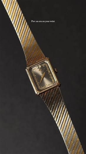 Curated Finds on Instagram: "Brand: Seiko Era: Vintage, likely from the 1980s or 1990s Style: Dress watch, minimalist, "tank" style with a square or rectangular case Material: Two-tone (gold and silver- colored) stainless steel case and mesh (Milanese) strap SOLID 🔥🔥🔥 Dial: Features a patterned or checkered dial in black/grey and gold tones with simple hour markers and a brand logo beneath the 12 o'clock position."
