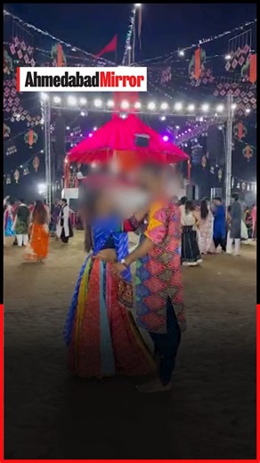 A video of a couple lip-kissing during the United Way Garba in Vadodara has gone viral, drawing sharp criticism from participants and cultural groups. The clip, widely circulated on social media, has raised concerns over obscenity at traditional Navratri festivities, with many calling for stricter monitoring at Garba venues. #GarbaControversy #NavratriDecorum #VadodaraViralVideo #CulturalSensitivity | Ahmedabad Mirror
