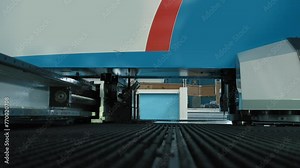 Modern cnc machinery is operating on the industrial processing line. CNC Machine is processing the steel detail on a production line. CNC Machine is processing the metal parts on a manufacturing line