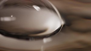 Download Big and medium bubbles floating and exploiding on water surface in 4K for free