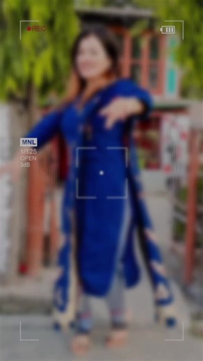 Traditional Dance Performance in Blue Embroidered Outfit