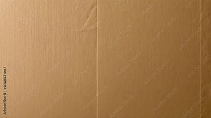 A plain cardboard box with a smooth surface and a vertical crease in the middle.