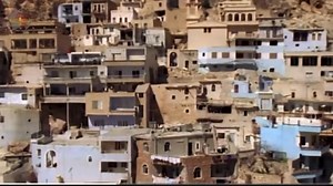 Maaloula (Arabic: مَعلُولَا; Western Neo-Aramaic: ܡܥܠܘܠܐ ,מעלולא, romanized: Maʿlūlā) is a town in southwestern Syria. The town is located in the Rif Dimashq Governorate and is 56 km northeast of Damascus, and is built into the rugged mountainside at an altitude of more than 1,500m. It is known as one of three remaining villages where Western Neo-Aramaic is spoken, the other two being the nearby smaller villages of Jubb'adin and Bakh'a. | Syriac Orthodox News