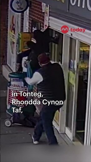 Woman dangling from shop shutters goes viral