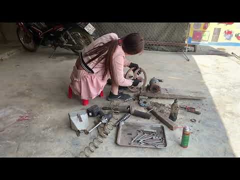Girl with great repair skills: Successfully restored a broken and rusted popcorn machine.