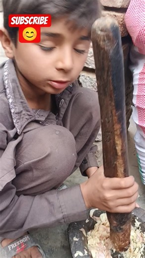 Cute Kid Grinding Garlic the Traditional Way