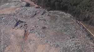 Garbage dump. Aerial view of garbage and waste storage. Birds eye view of garbage field. Wastes of life and production. Environmental pollution. Piles of trash