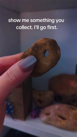 Hagstones- also known as adder stones, witch stones, Odin's stones, and fairy stones. These are used for a bunch of different things but the most popular seems to be looking through the hole to connect with the spirit realm. I use them to help with divination and as offerings ✨. #hagstones #witch #witchcraft #collector #fairy