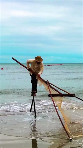 Traditional Stilt Fishing Technique by the Sea