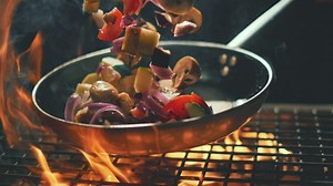 Vegetables into the pan in slow motion - Free Stock Video