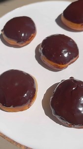 Boston Cream Donuts 4 cups all purpose flour 1 cup of warm milk 1/2 cup sugar 1 tablespoon of yeast 1 teaspoon salt 2 eggs 1/3 cup melted butter Oil for frying, preferably corn oil or vegetable oil In a large bowl put the warm milk & yeast let it sit for 5 minutes. The mix in sugar, salt, eggs and butter. Finally add the flour mix for a minute and let it sit for 5 minutes. Allow the dough to rest in a warm area covered with a warm towel for an 1 hour. Make the pastry cream recipe below. Once you