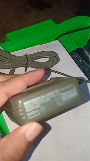 Nintendo AC adapter usg-002(asi) input 220v-240v 50hz/60hz 3.4w output 5.2v 450mA Made in China