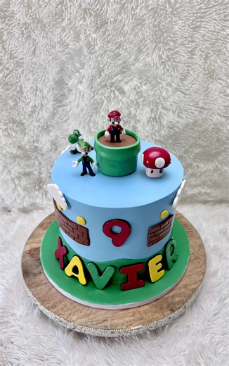 Putting together a Super Mario theme cake , it’s a red velvet cake with buttercream filling covered in fondant with fondant toppers #cakesbyshamie #queensbaker #queens #supermariocake #fondantcake