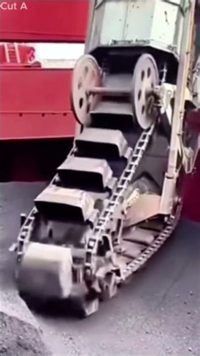 Ship Unloader Scooping Coal with a Chain Conveyor